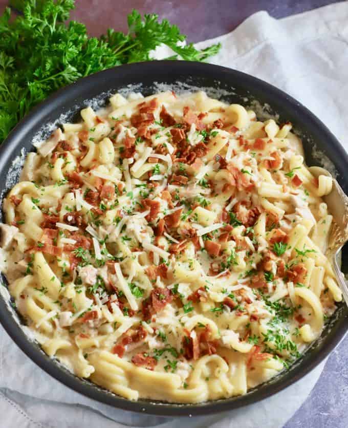 Chicken and bacon pasta in a skillet ready to eat.