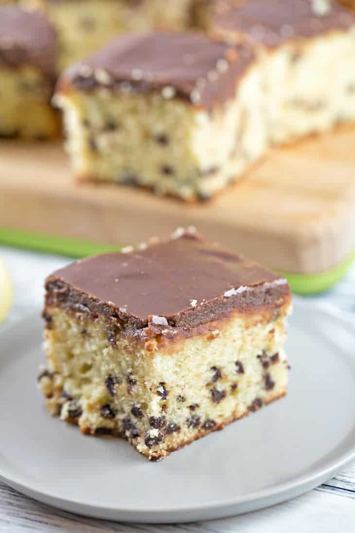 Chocolate chip pound cake on a white plate.