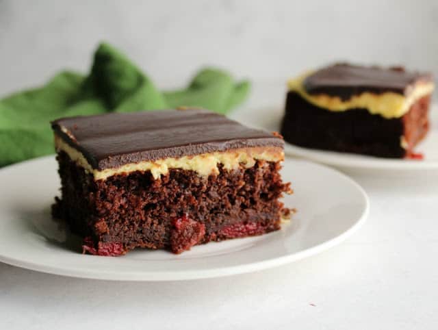 A slice of Black Forest Sheet Cake on a white plate.