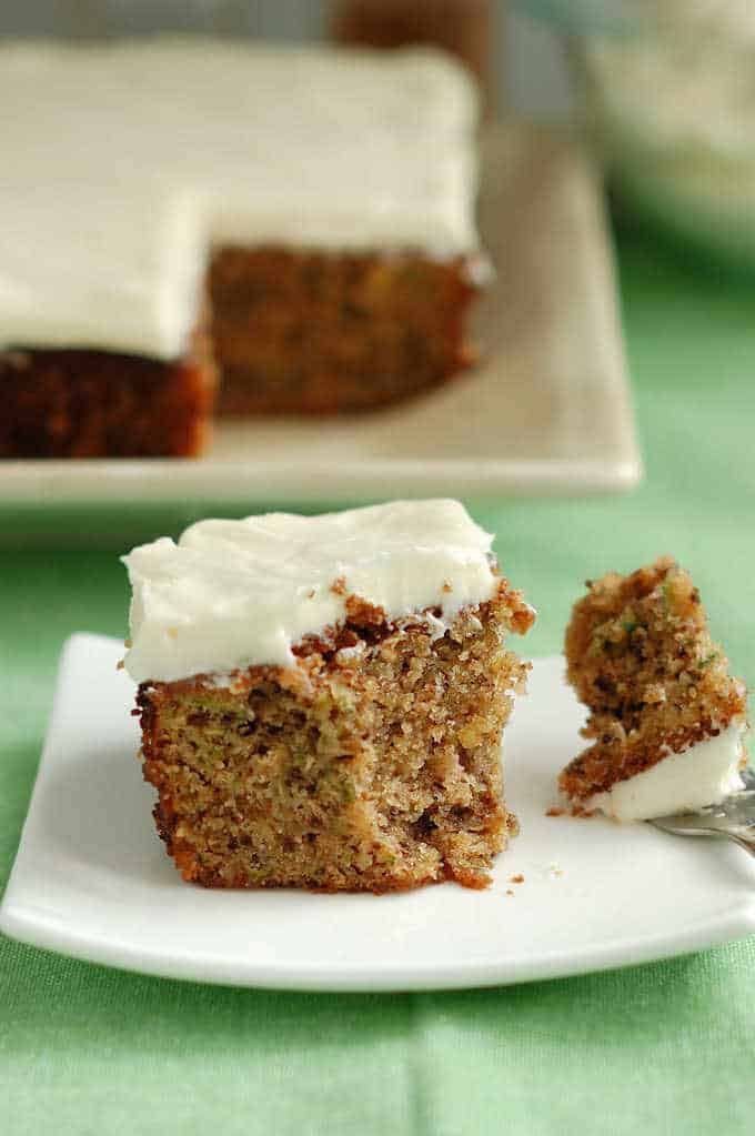 A slice of Zucchini Cake with Cream Cheese Icing.