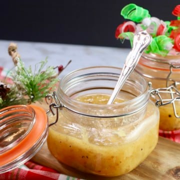 A jar of jezebel sauce with a spoon.