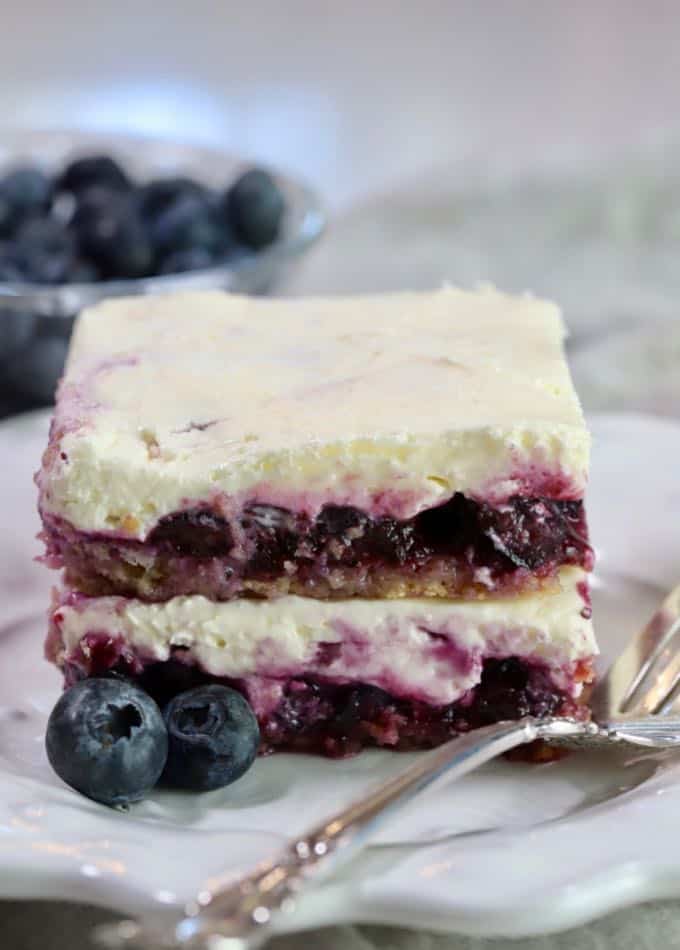 Blueberry delight on a white plate with a fork. 