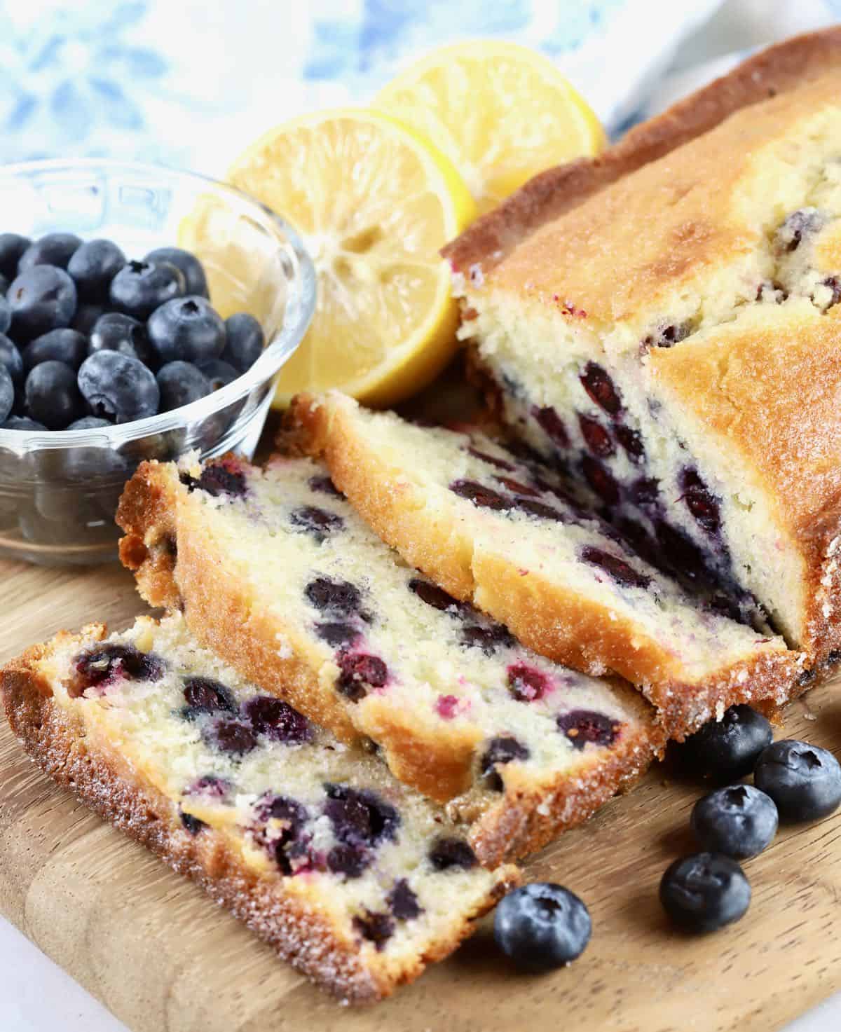 A loaf of blueberry bread cut into slices. 