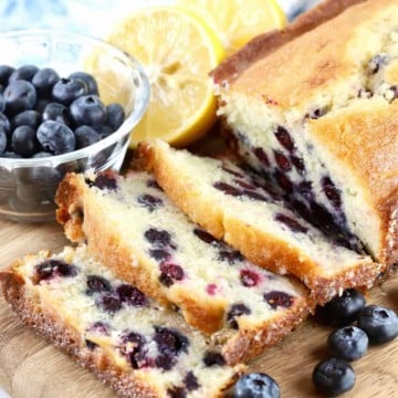 Slices of blueberry bread on a cutting board.