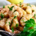 Smoked shrimp on a plate garnished with parsley.