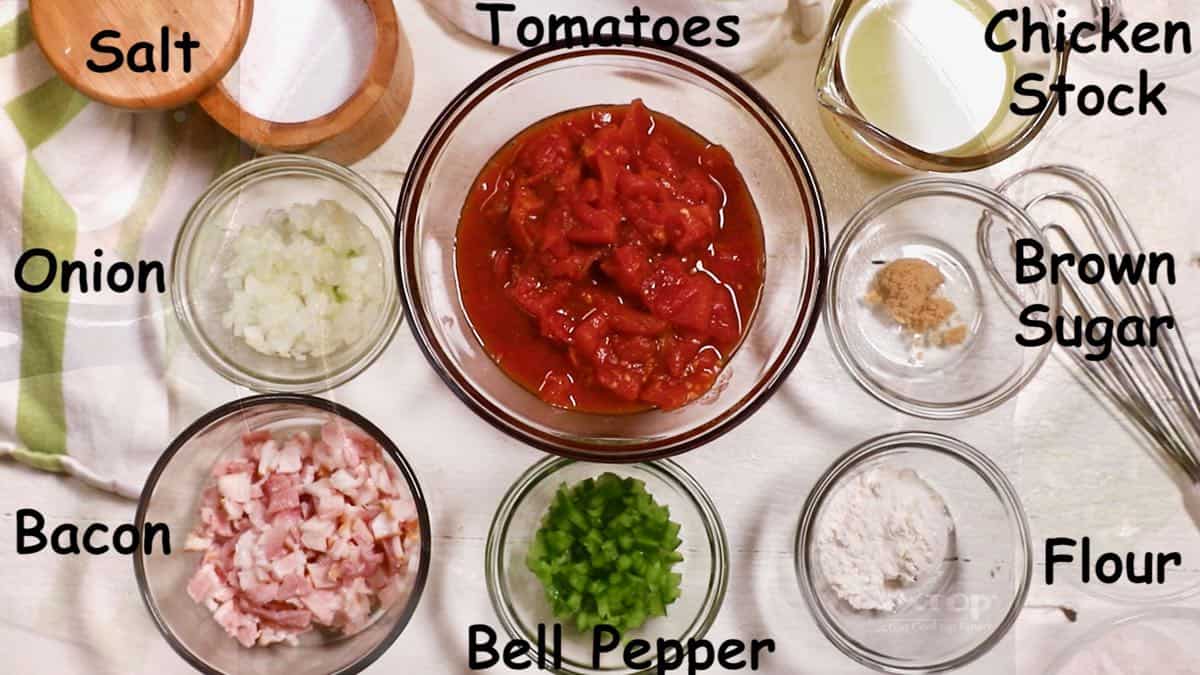 Bowls of tomatoes, onions, peppers, and chopped bacon. 