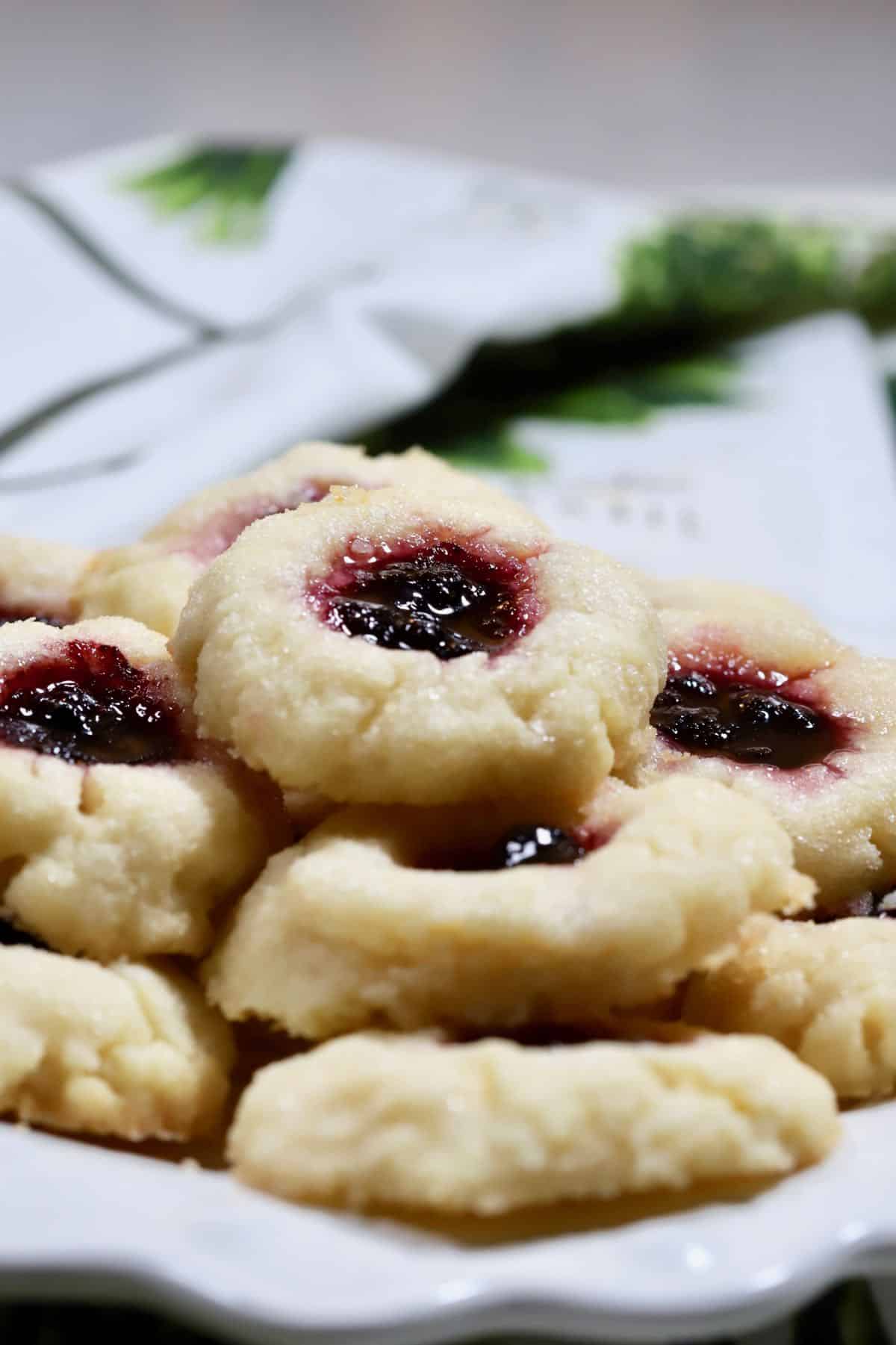 A white plate full of cookies. 