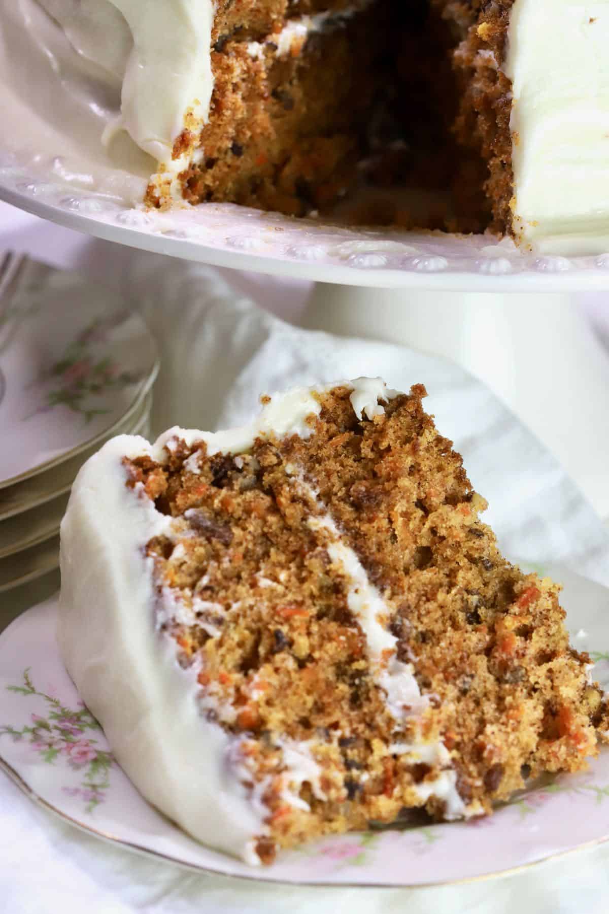 A slice of carrot cake with cream cheese icing. 