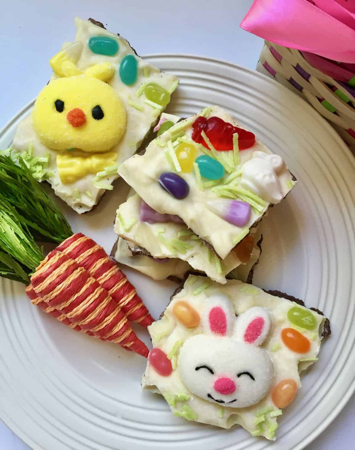 Pieces of easter candy on a white plate. 