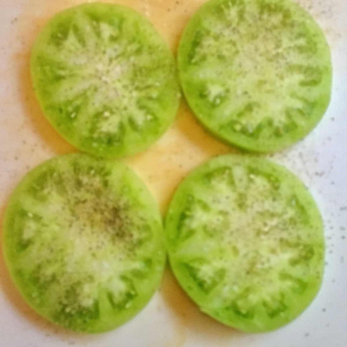 Four slices of green tomatoes. 