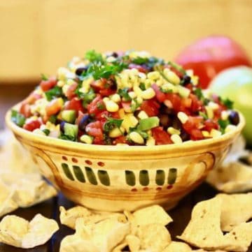 Redneck caviar in a pottery bowl surrounded with chips.