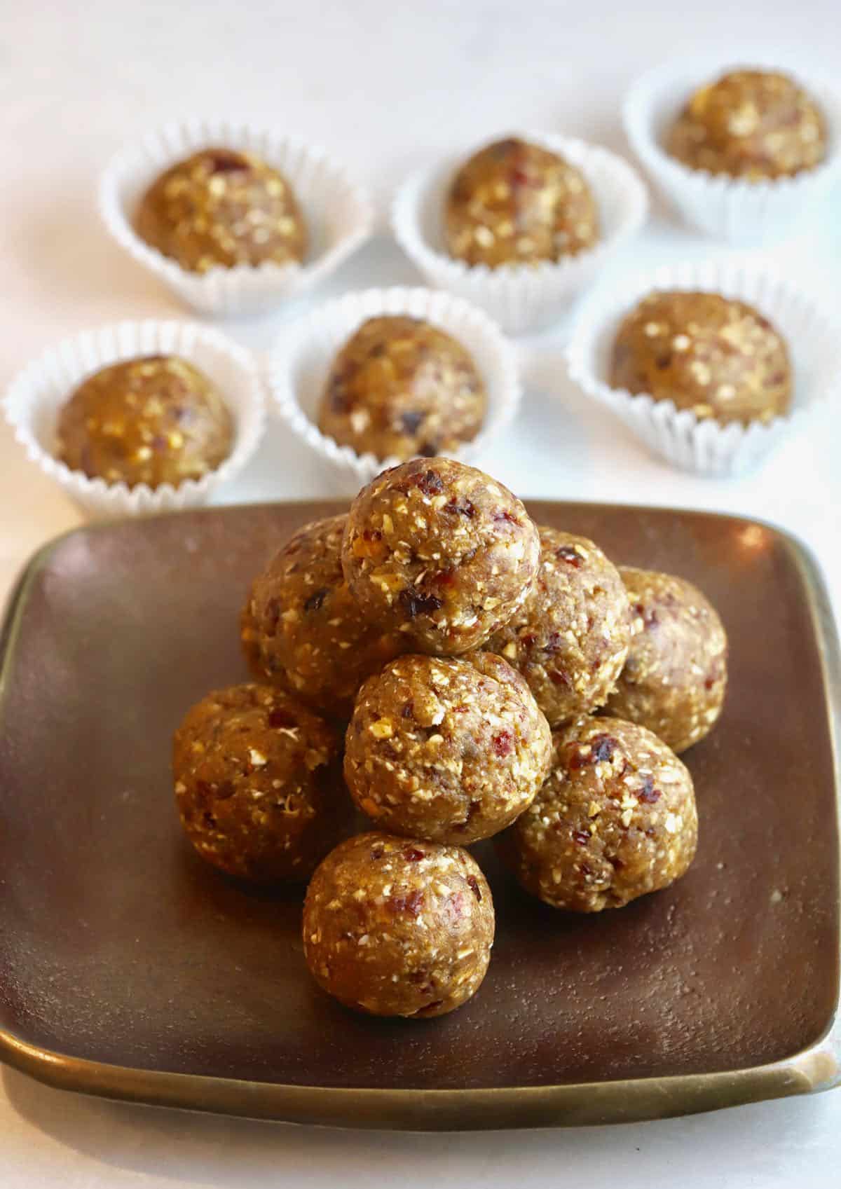 Oatmeal energy balls on a bronze plate. 