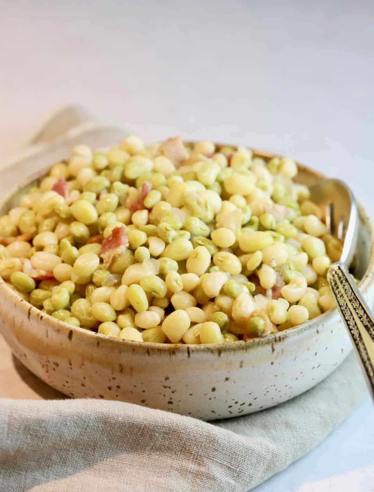 A bowl full of zipper peas. 