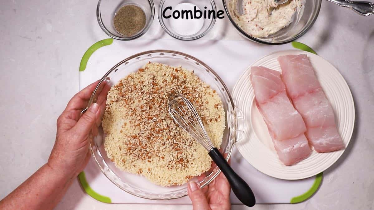 Chopped pecans and panko in a shallow glass dish. 