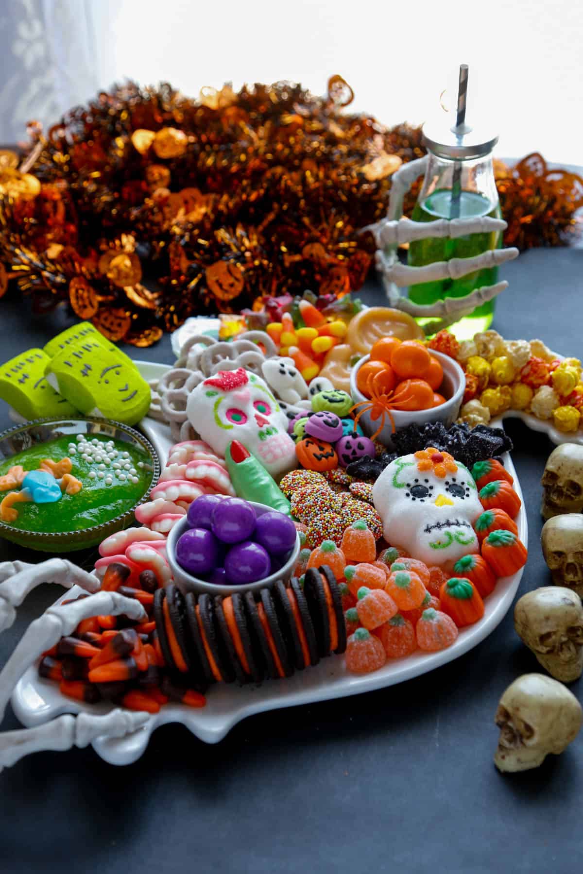 Halloween charcuterie board full of different kinds of halloween candy. 