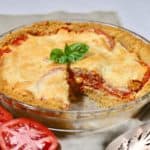 Tomato pie with a slice cut out.