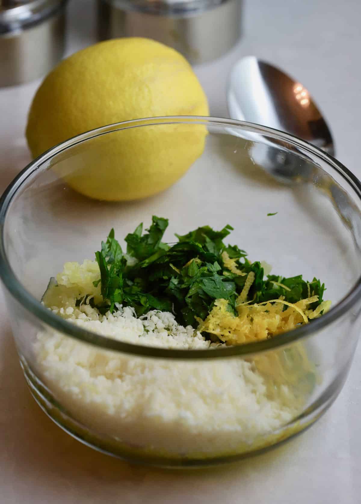 Parmesan cheese, lemon zest and parsley in a small bowl. 