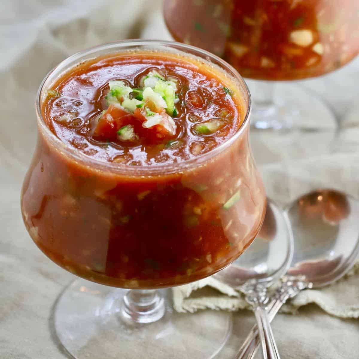 Cold Spanish Soup in glass bowls.