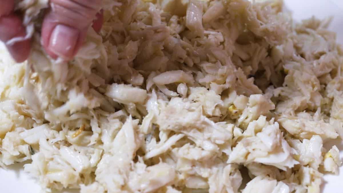 Picking through crabmeat for bits of shell. 