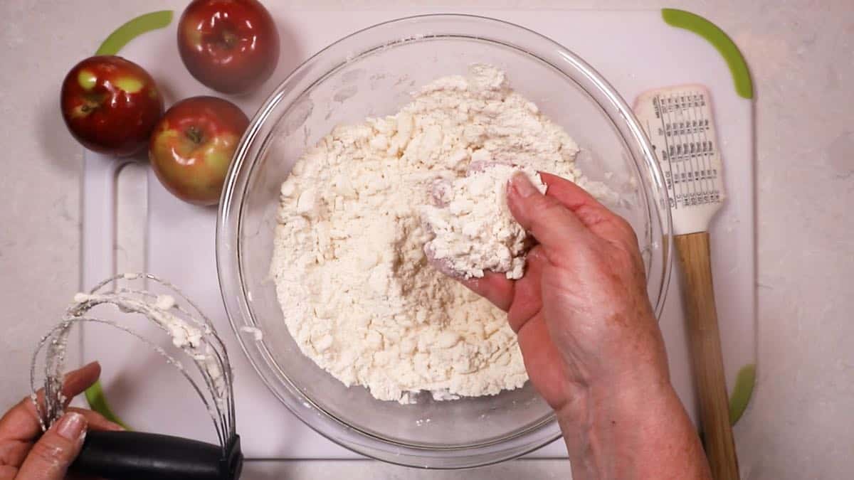 Pastry dough in a clear glass bowl. 