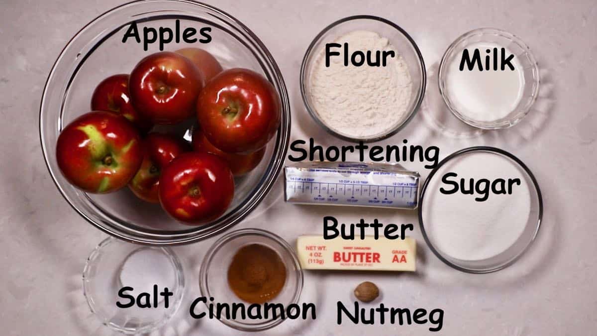 Ingredients for apple dumplings including a bowl of apples. 