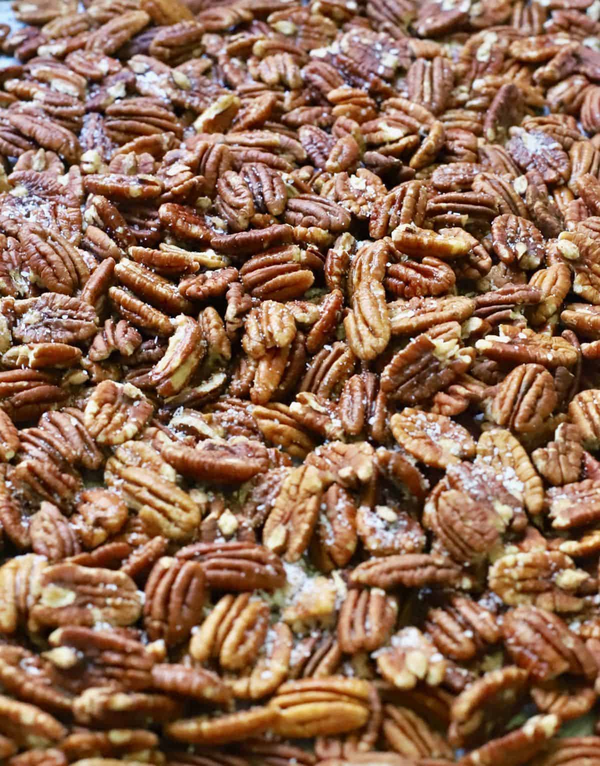 A pan full of roasted pecans. 