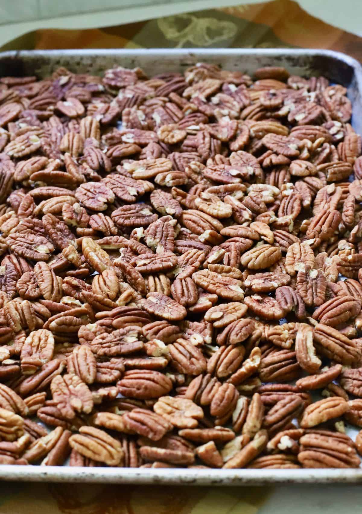 A pan full of raw pecan halves. 