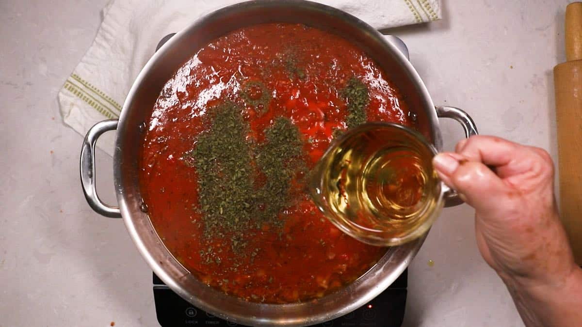 Cooking marinara sauce in a skillet. 