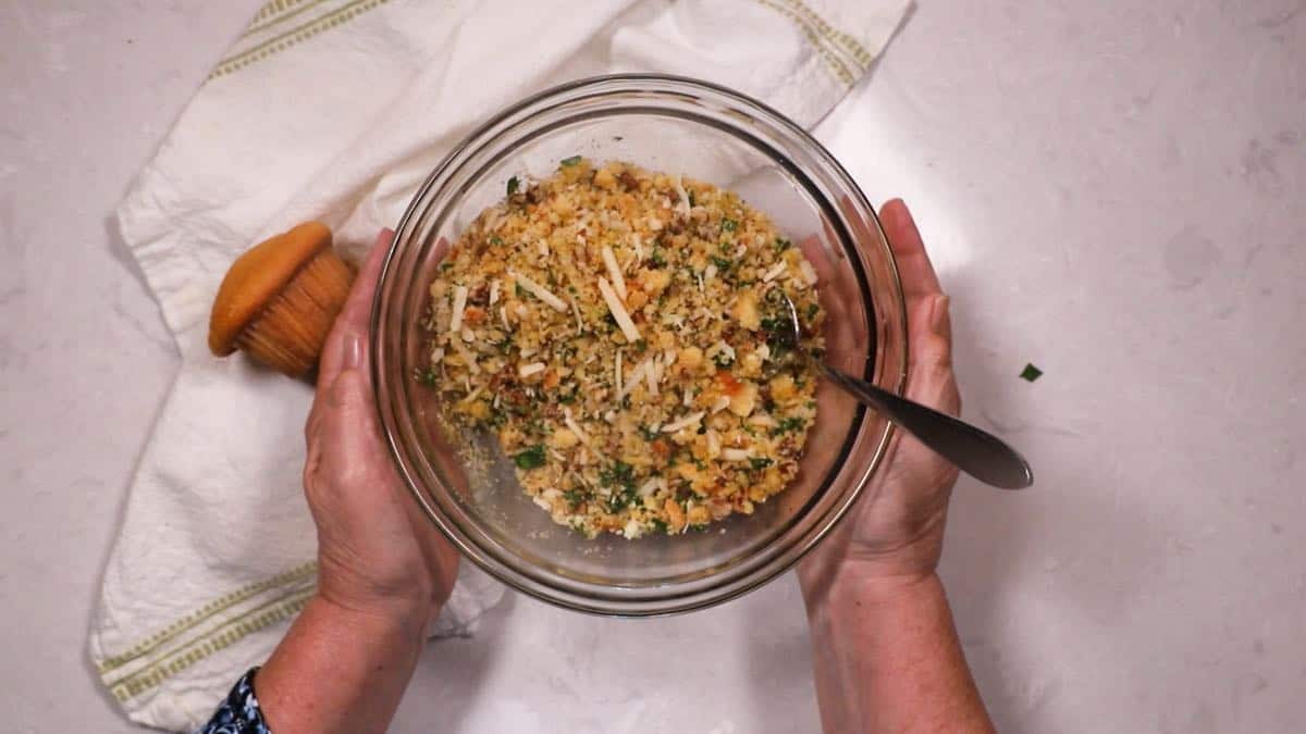 Cornbread stuffing in a clear glass bowl. 