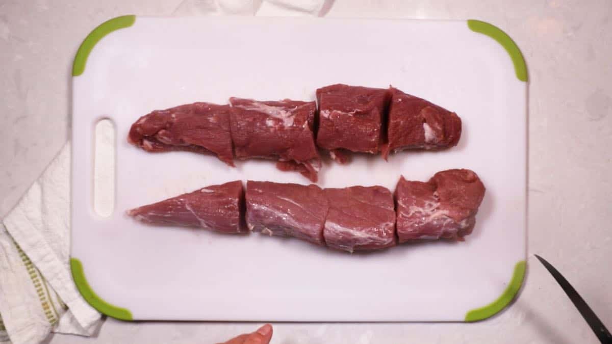 Two pork tenderloins cut into eight pieces. 