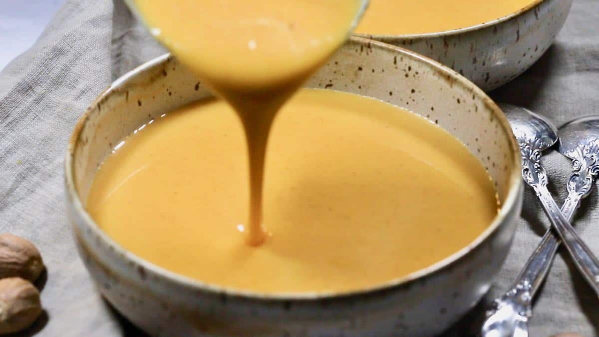 Pouring soup into bowls. 