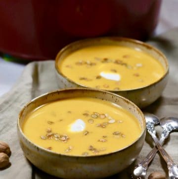 Pumpkin and Sweet Potato Soup in two bowls.
