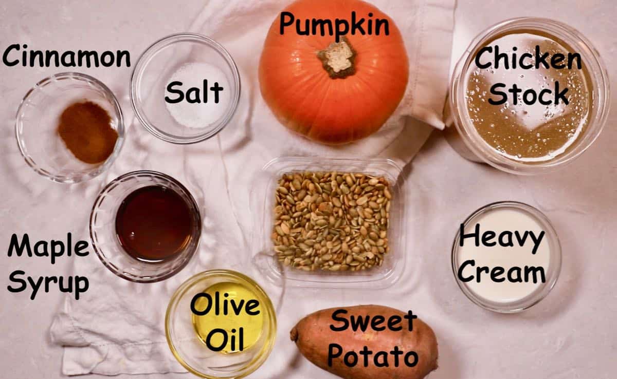 Recipe ingredients including a whole pumpkin and sweet potato. 