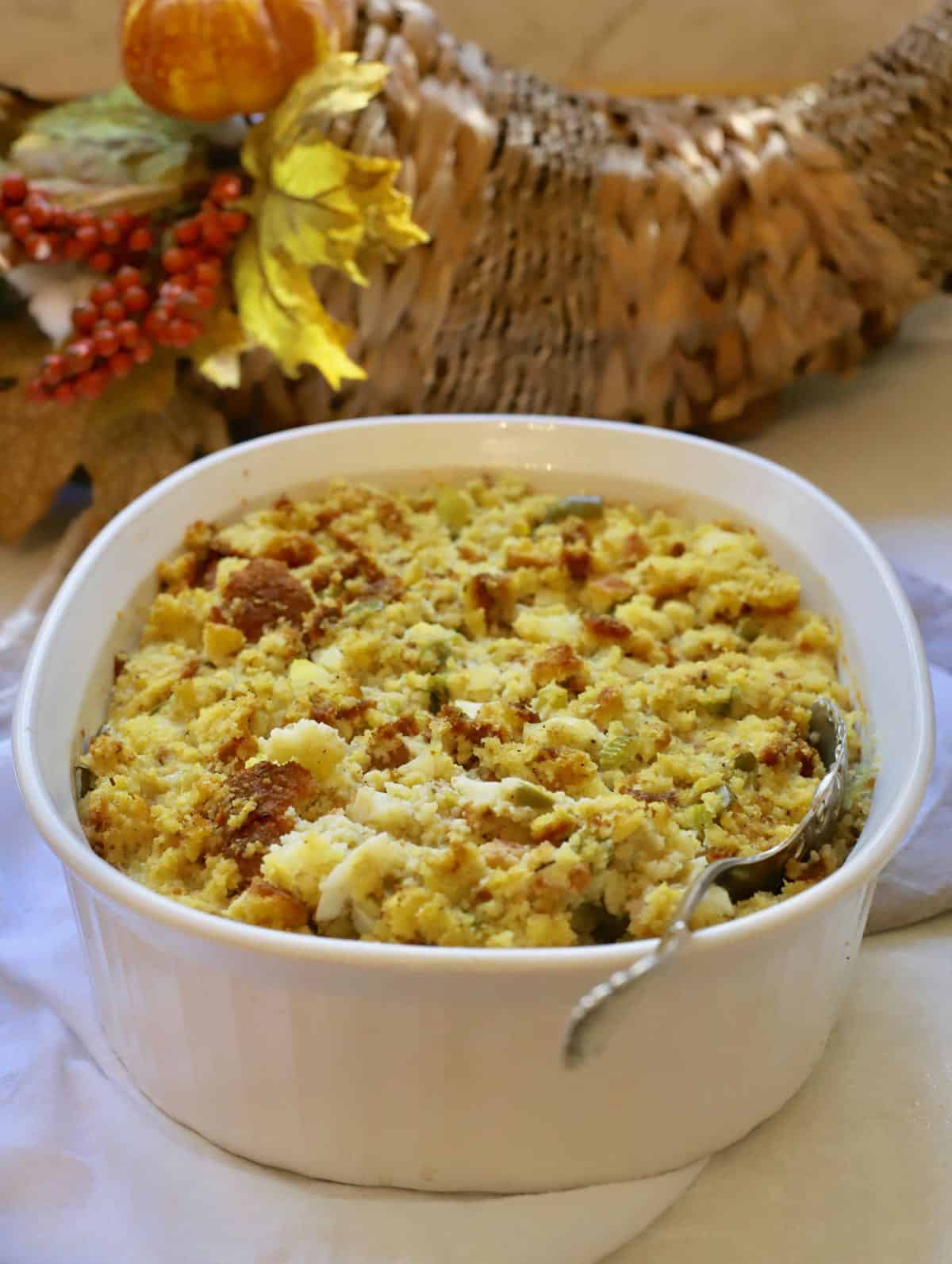 Southern cornbread dressing in a white baking dish. 