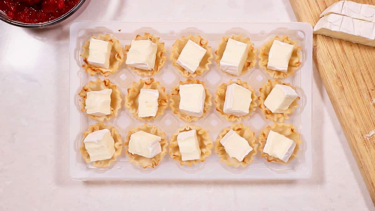 Filo cups with cubes of brie cheese. 