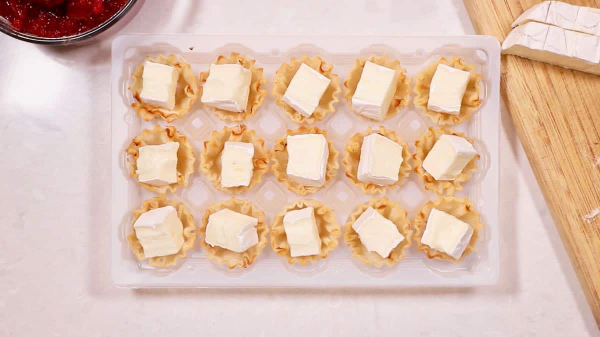 Filo cups with cubes of brie cheese. 