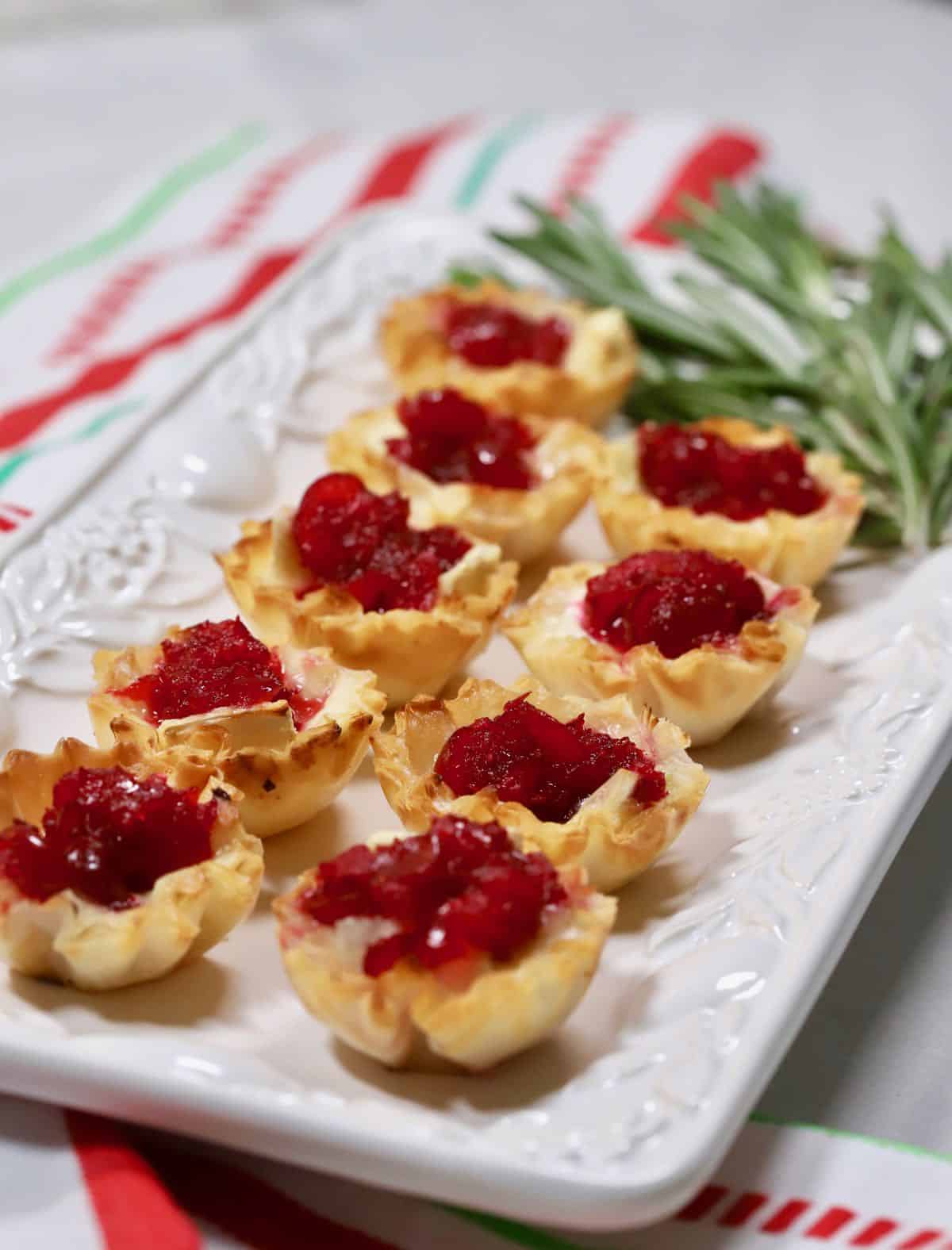 Cranberry Brie Bites on a white serving dish. 