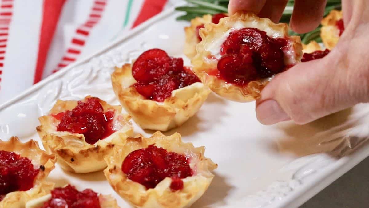 Brie bites garnished with rosemary. 