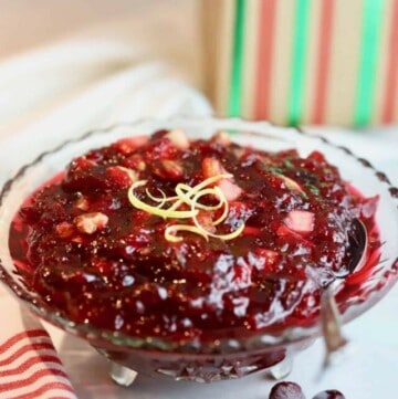 Cranberry sauce in a clear glass bowl.