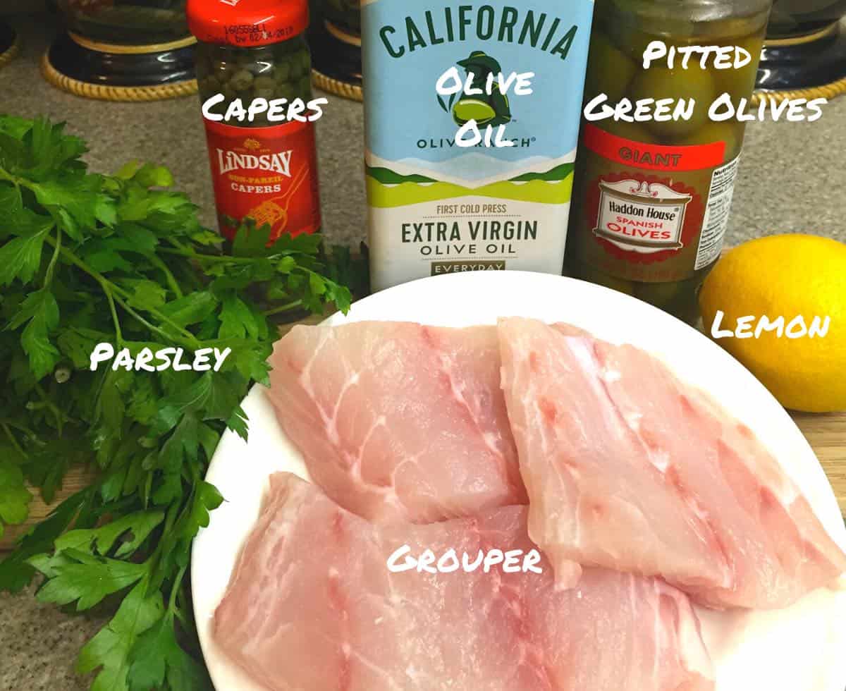 Ingredients including grouper fillets for a fish recipe. 