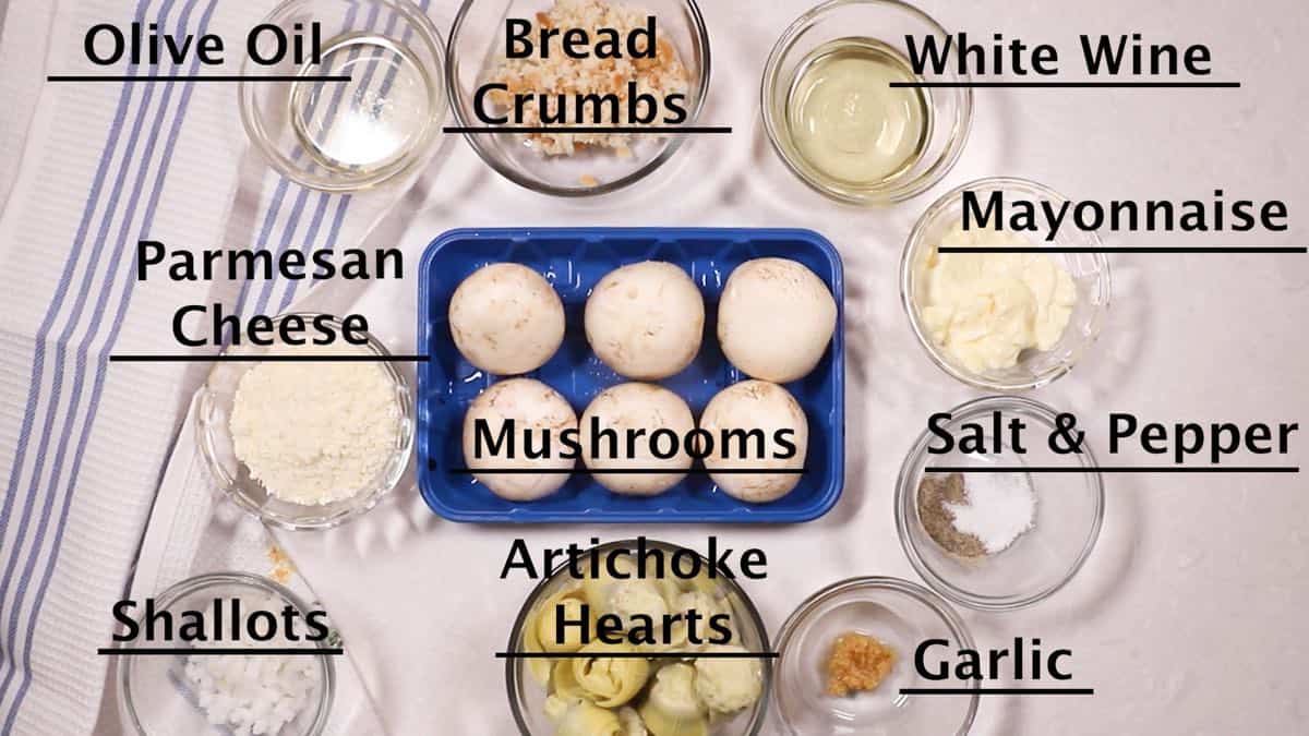 Mushroom caps, artichoke hearts, and other ingredients for stuffed mushrooms. 