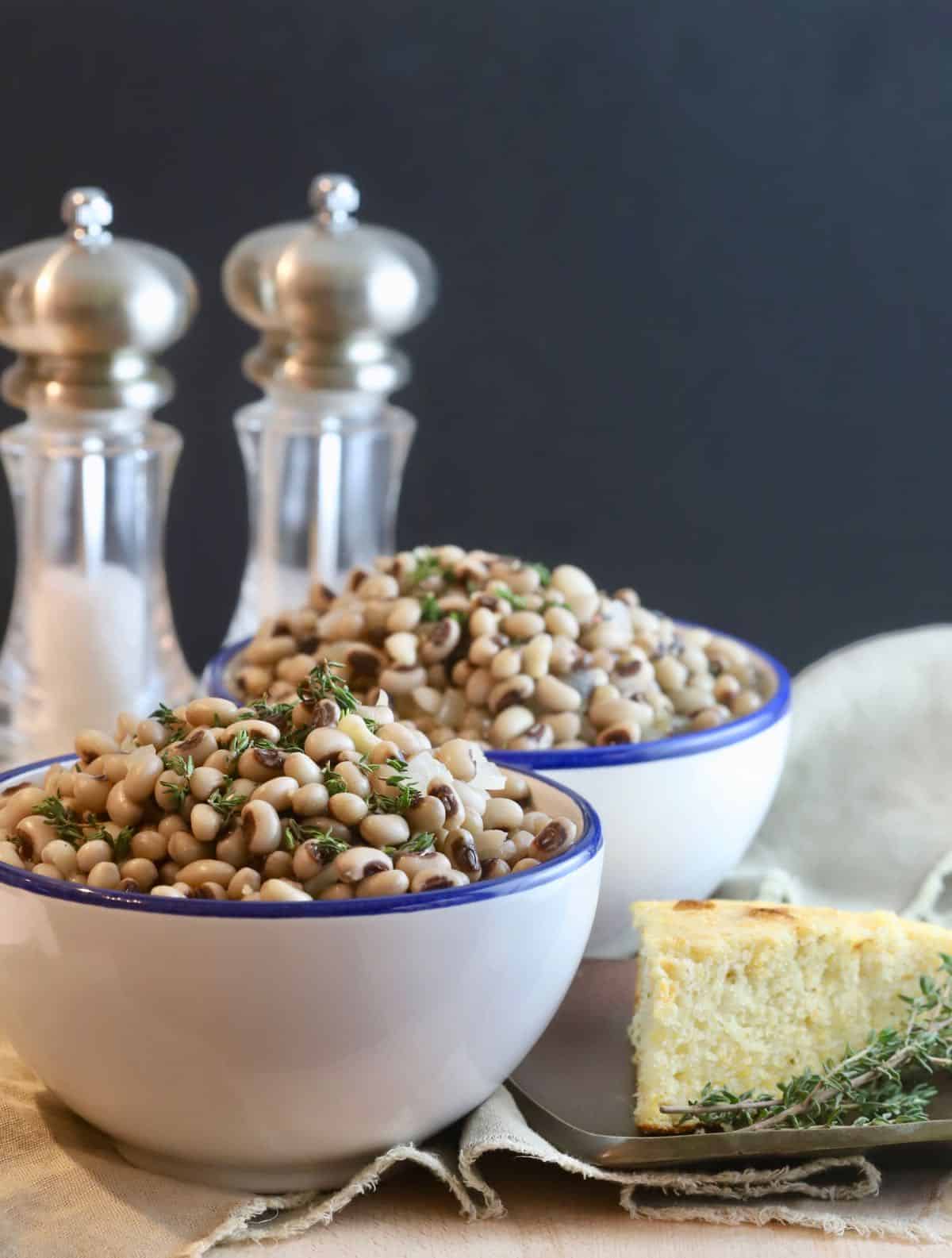 White bowls full of black-eyed peas. 