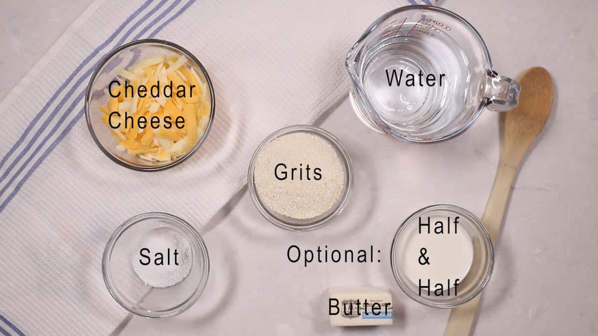 Grits, water, salt and cheese on a kitchen counter. 