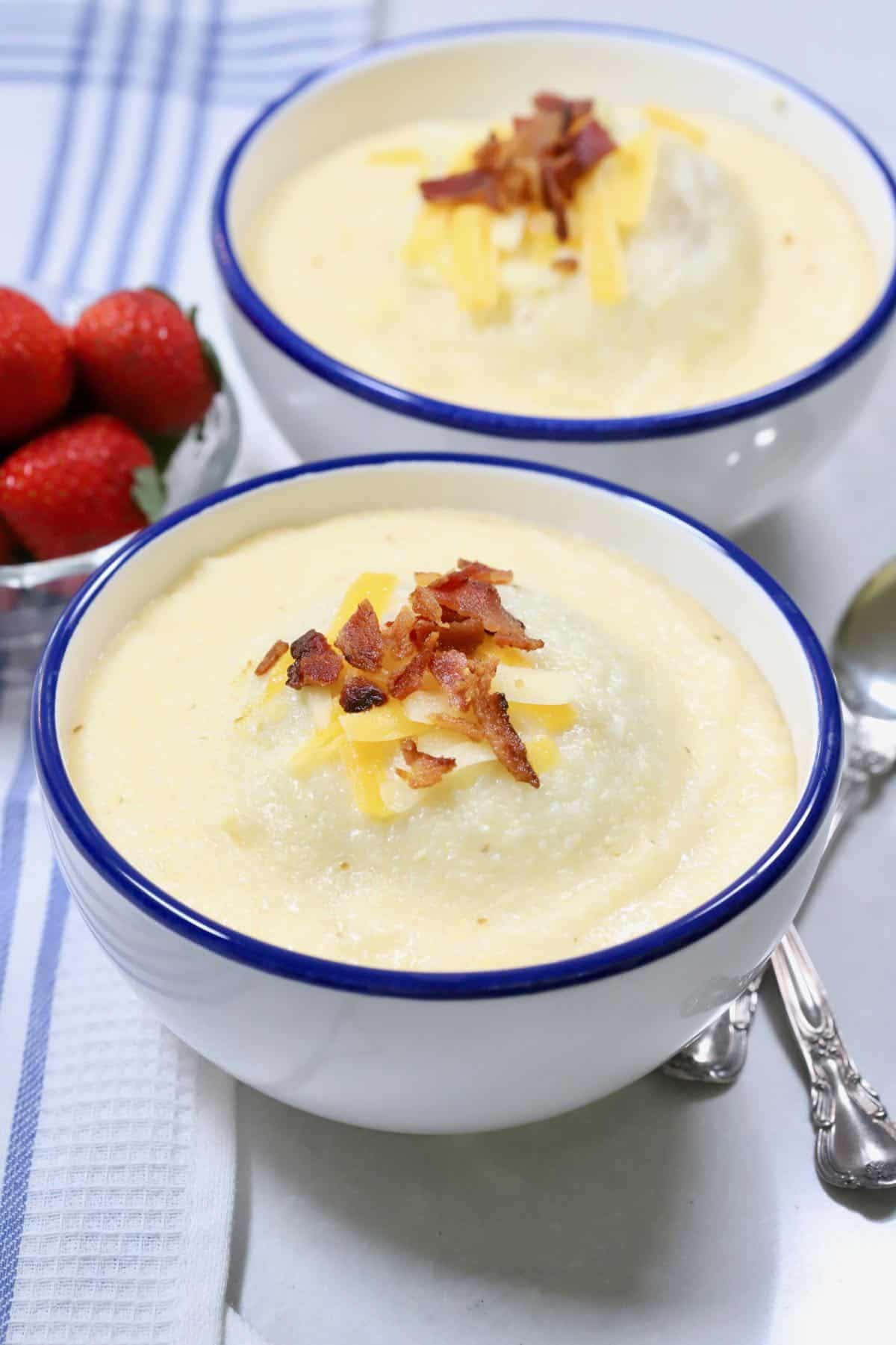 Cheese grits topped with cheese and bacon. 