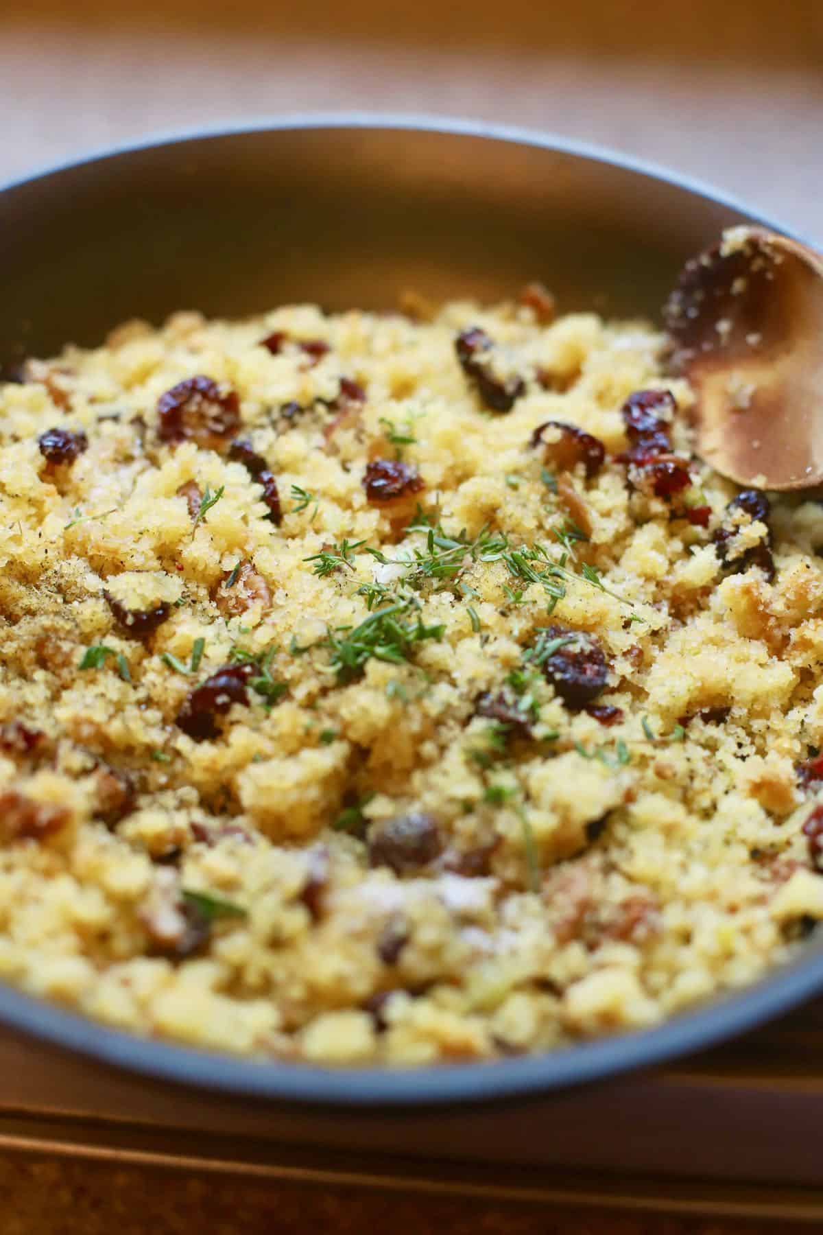 Cornbread and cranberry dressing in a skillet. 