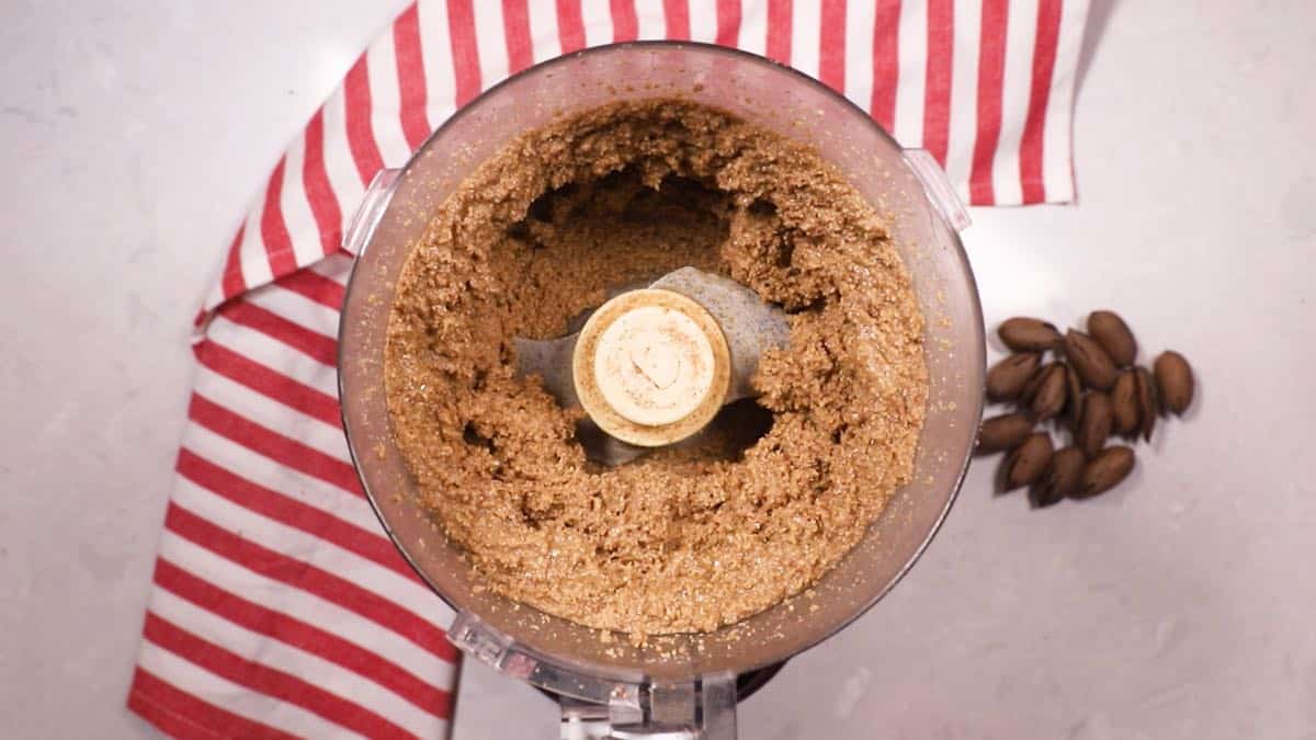 Pecans processed into a thick paste.