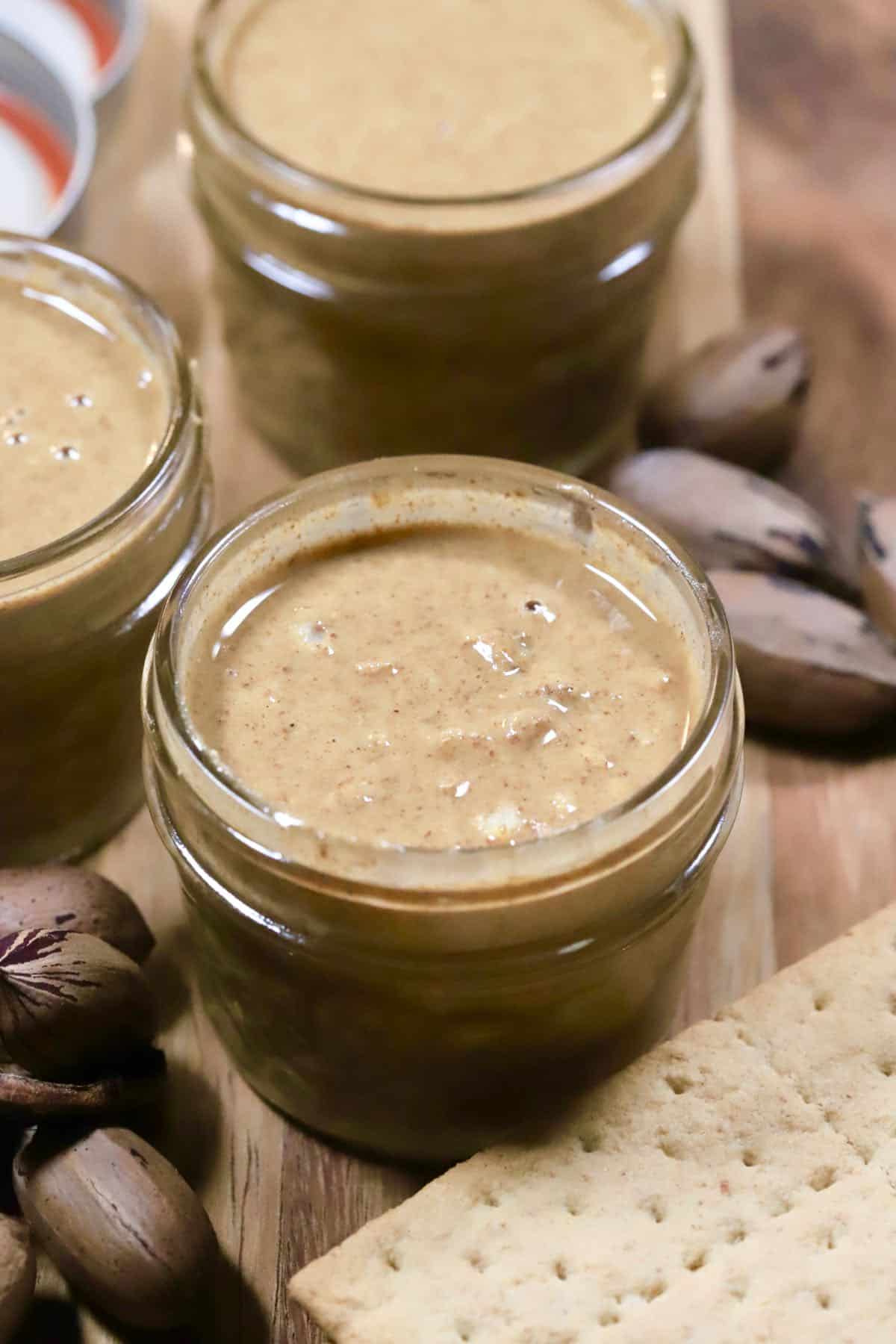 A jar of crunchy pecan butter. 