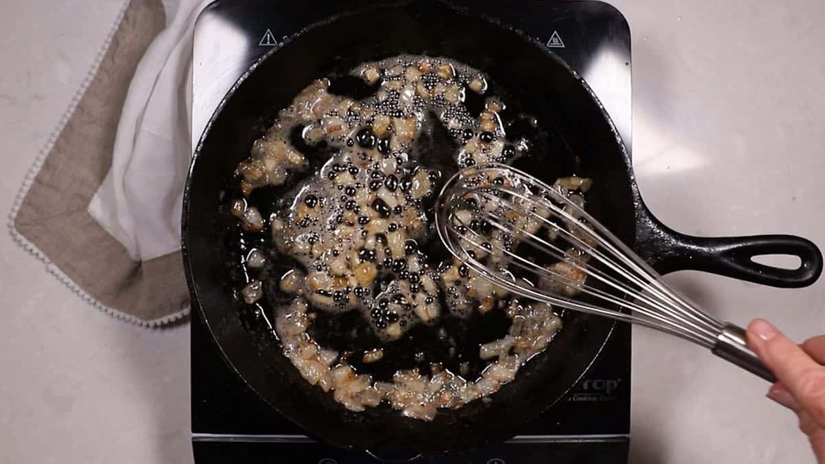 Cooking onions in a cast iron skillet. 