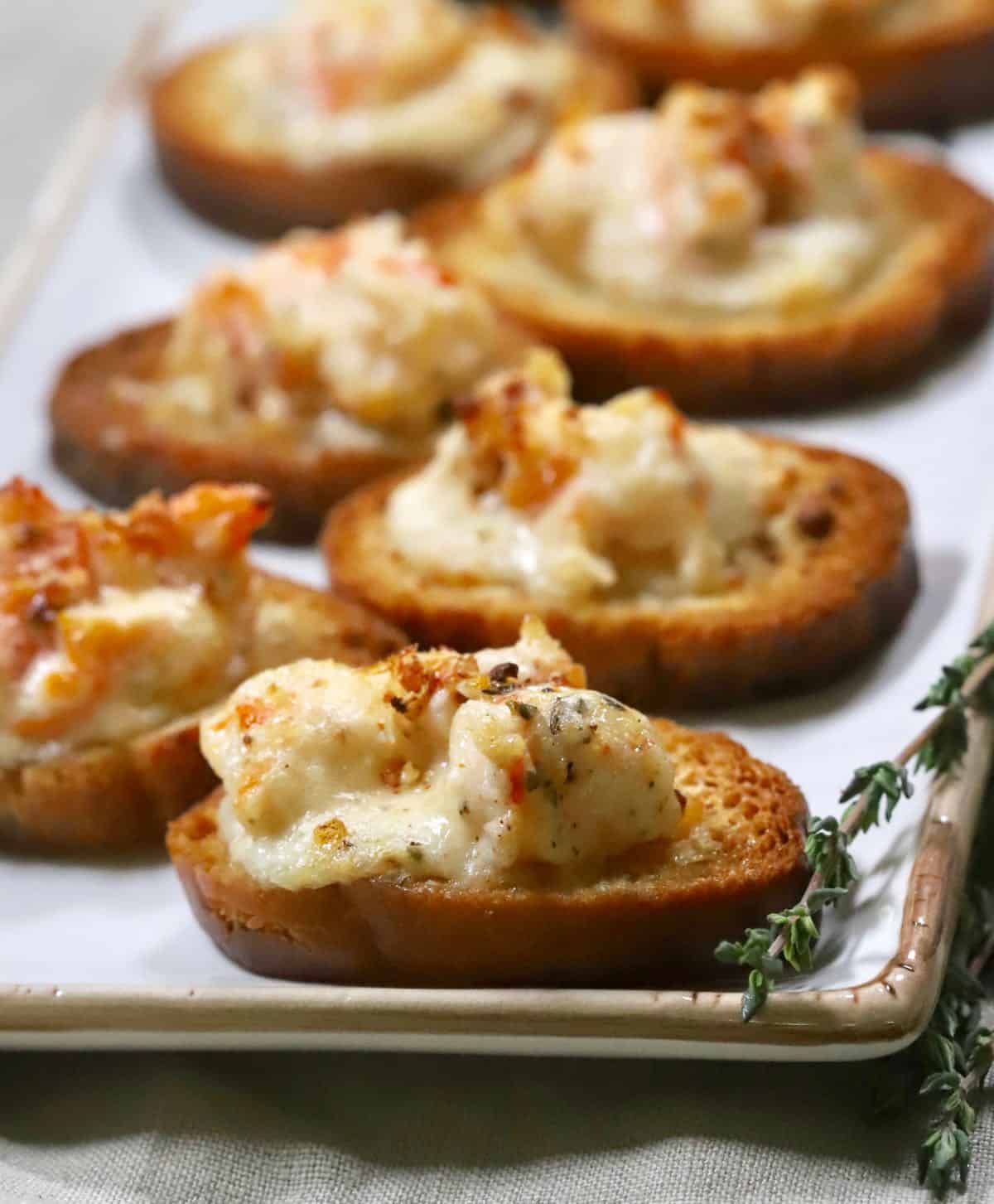 A serving dish with baked shrimp toast. 