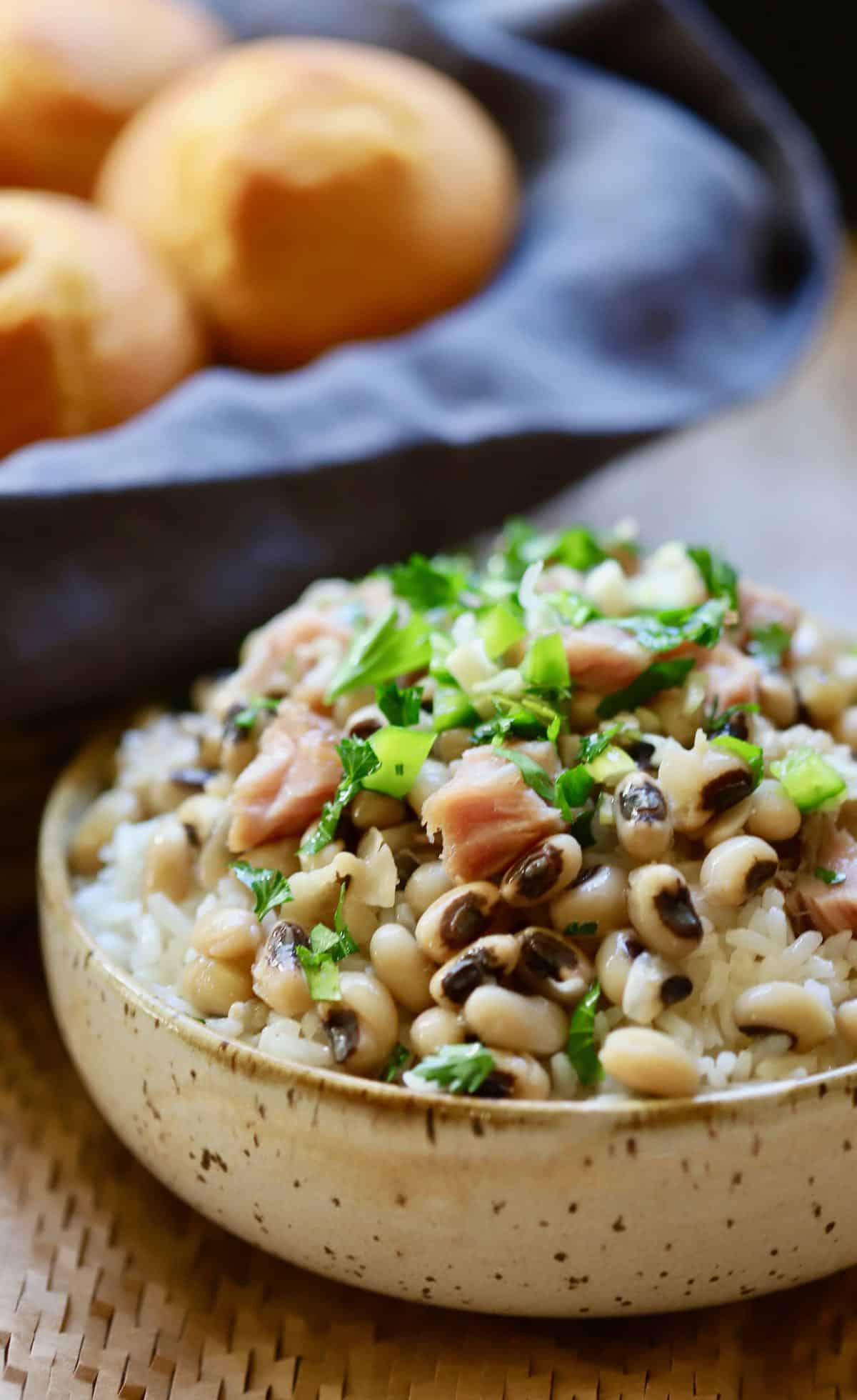A large bowl of Hoppin' John garnished with parsley. 